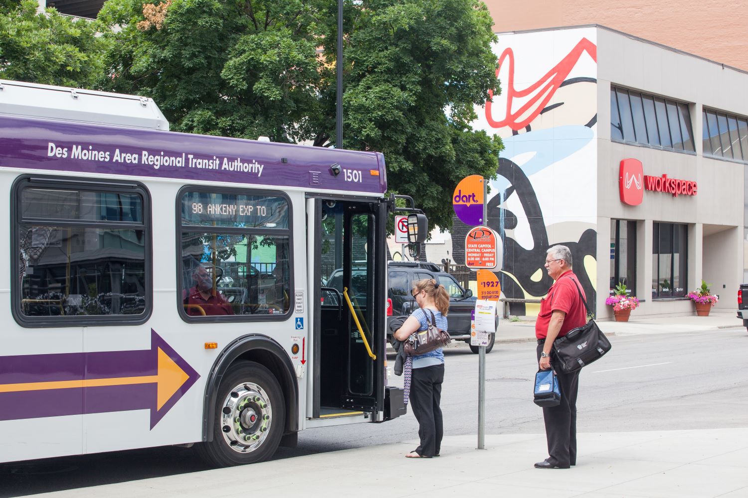 riders getting on bus