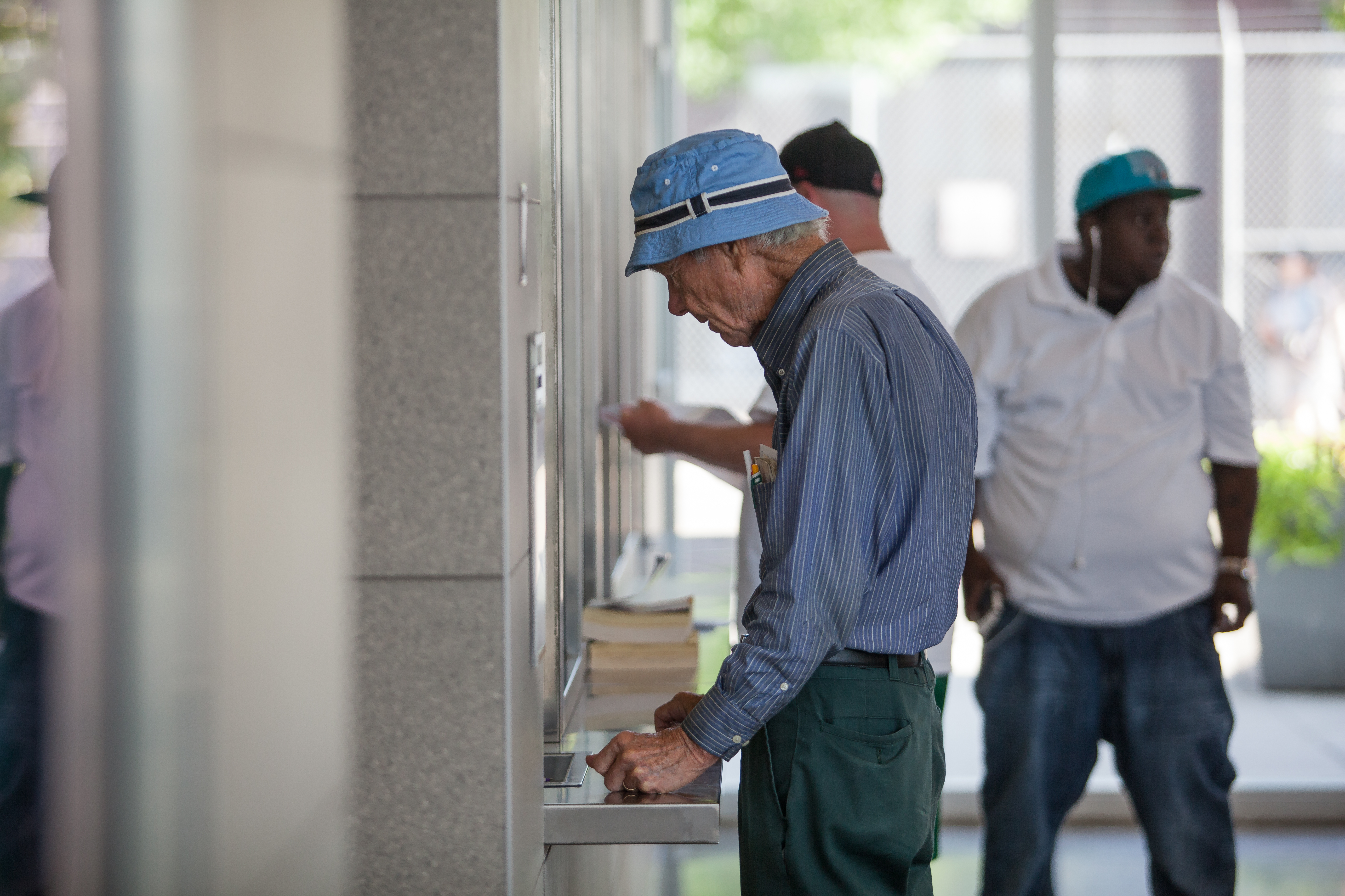 Photo of a man receiving information at DART's Customer Service Window